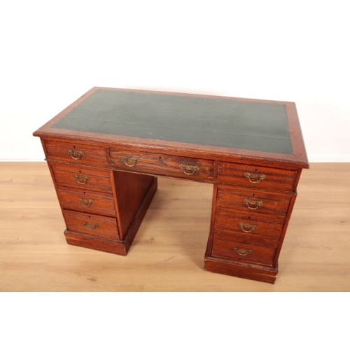 62 - A LATE VICTORIAN OAK PEDESTAL DESK

reeded throughout, the top with green leather cloth, fitted nine... 