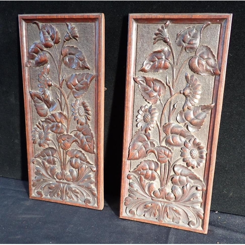 10 - TWO CARVED OAK PANELS

each with flowering foliage, 45cm x 19.5cm