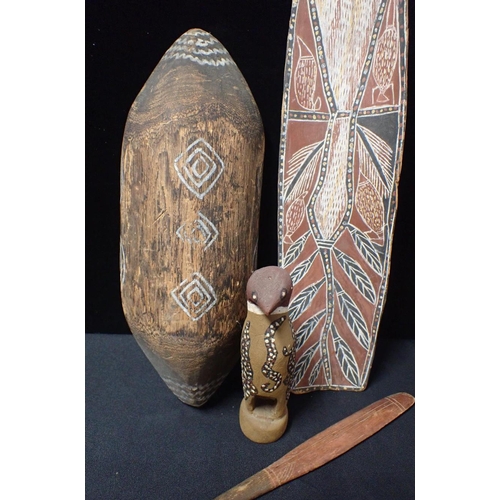 102 - FOUR AUSTRALIAN CARVED AND WOODEN ARTEFACTS

A bird, shield, stick and a bark panel (measures 50.5cm... 