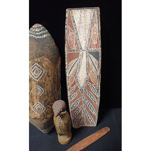 102 - FOUR AUSTRALIAN CARVED AND WOODEN ARTEFACTS

A bird, shield, stick and a bark panel (measures 50.5cm... 