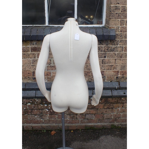 147 - A SHOP DISPLAY MANNEQUIN

with movable arms, on metal stand 143cm high