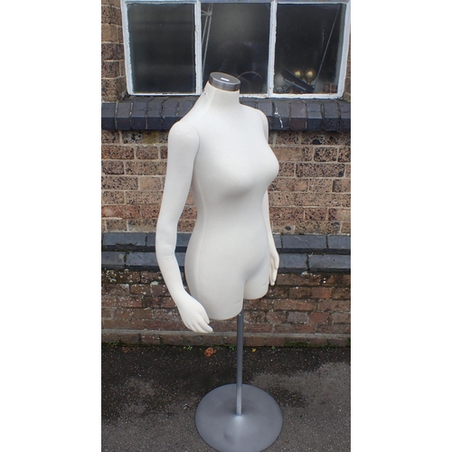 147 - A SHOP DISPLAY MANNEQUIN

with movable arms, on metal stand 143cm high