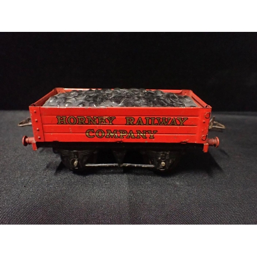 196 - HORNBY 0 GAUGE UNUSUAL GOODS WAGONS

Hornby Railway Company coal truck, snow plough, two Wakefield C... 