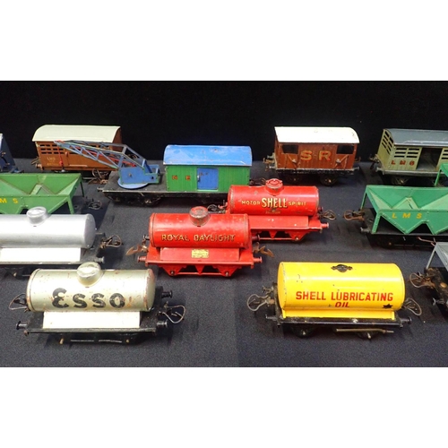 204 - A COLLECTION OF HORNBY 0 GAUGE GOODS WAGONS

mostly played with, tank wagons and hopper wagons