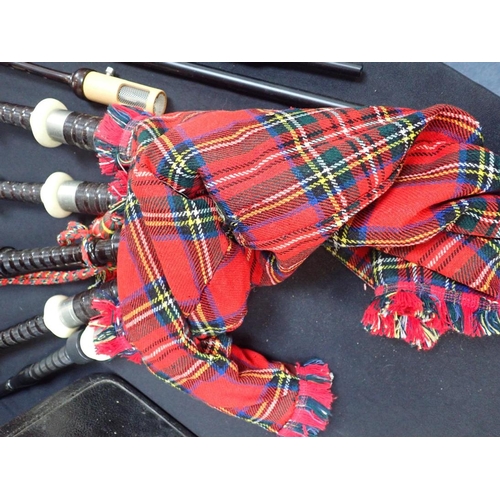 211 - A SET OF CASED 20TH CENTURY BAGPIPES

in turned darkwood and white metal furrules, moulded soles, no... 