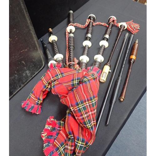 211 - A SET OF CASED 20TH CENTURY BAGPIPES

in turned darkwood and white metal furrules, moulded soles, no... 