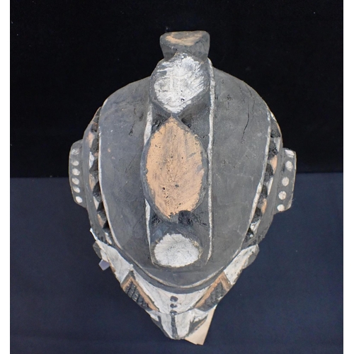 237 - AN IBO (IGBO) MAIDEN SPIRIT MASK

with white face and raised leaf crest 36cm high (old label attache... 