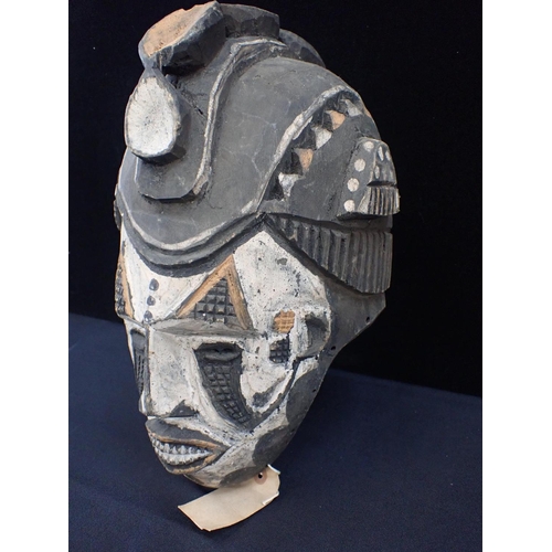 237 - AN IBO (IGBO) MAIDEN SPIRIT MASK

with white face and raised leaf crest 36cm high (old label attache... 