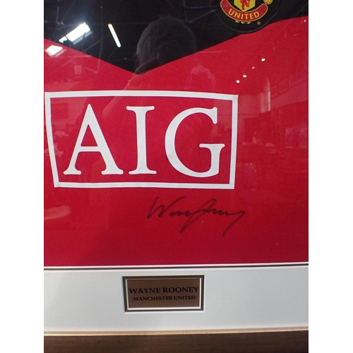 238 - 'WAYNE ROONEY' SIGNED FRAMED SHIRT

A replica Manchester United shirt hand signed by 'Wayne Rooney',... 