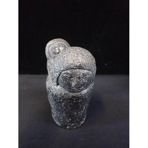 244 - TWO 'ESKIMO ART CANADA' CARVED STONE FIGURES - HUNTER AND WALRUS

two similar carved stone figures, ... 