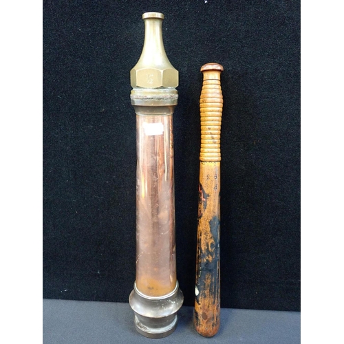 261 - A COPPER AND BRASS FIRE HOSE NOZZLE

45cm long, and a 19th century Constable's truncheon (paint very... 