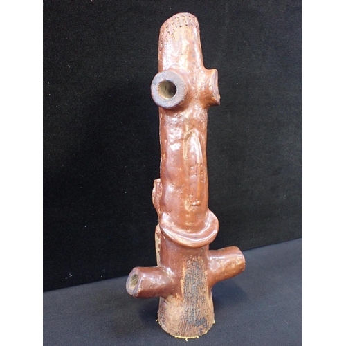 295 - A BROWN GLAZED ZOOMORPHIC FIGURE

with stamped impressed marks 41cm high