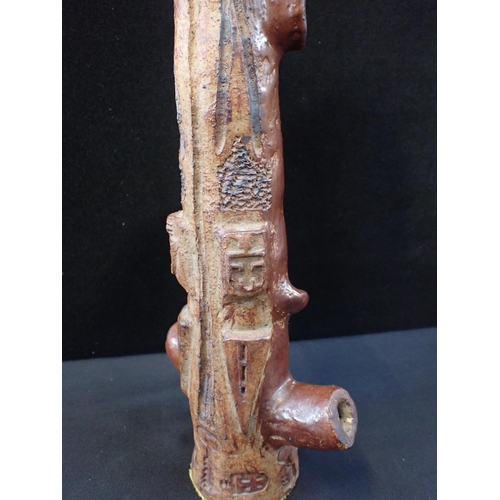 295 - A BROWN GLAZED ZOOMORPHIC FIGURE

with stamped impressed marks 41cm high