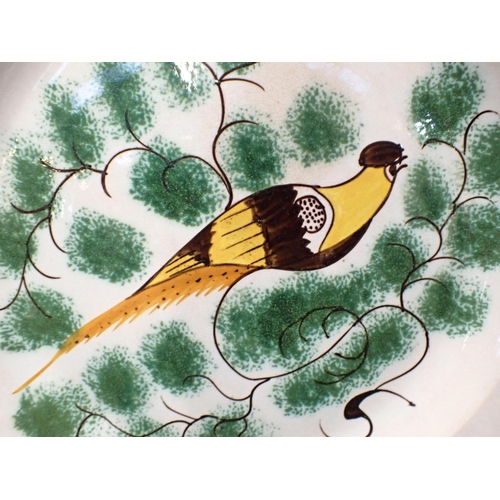 311 - THREE EARLY 19TH CENTURY 'PEAFOWL' PEARLWARE PLATES

decorated in brown and yellow amongst sponged g... 