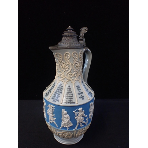 320 - A VILLEROY & BOCH STONEWARE BEER FLAGON WITH METAL LID

19th century, decorated with figures in reli... 