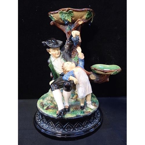 322 - A MAJOLICA CENTRE PIECE

Wilhelm Schiller & Son, Bohemia, 1880s, with a Bacchic theme, 40cm high