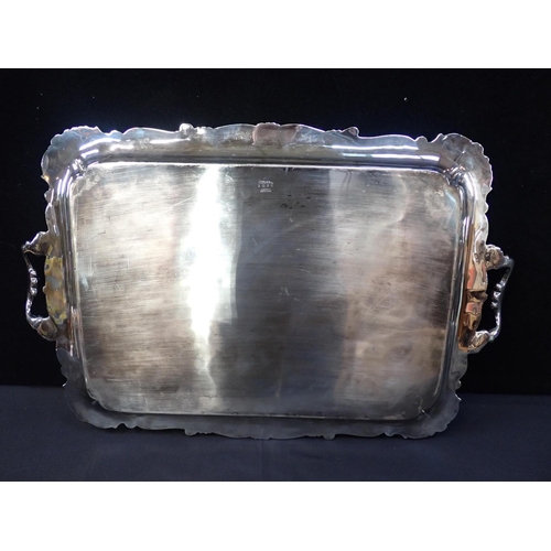 362 - A VICTORIAN SILVER PLATED TWO HANDLED TRAY

with raised Rococo border and engraved centre 65 x 43cm,... 