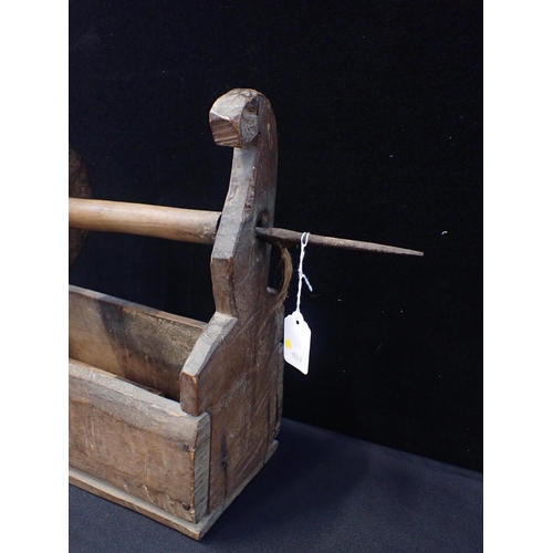 37 - A 19th CENTURY RUSTIC WOODEN AND IRON WINDER

the iron spindle 54cm long, the box 37cm wide