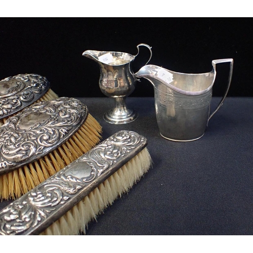 402 - A QUANTITY OF SILVER AND WHITE METAL WARE

including hairbrushes, a cigar cutter/match holder, a par... 