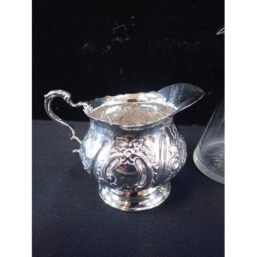 403 - TWO SILVER MOUNTED WHISKY TOTS OR NOGGINS

and a Victorian silver cream jug