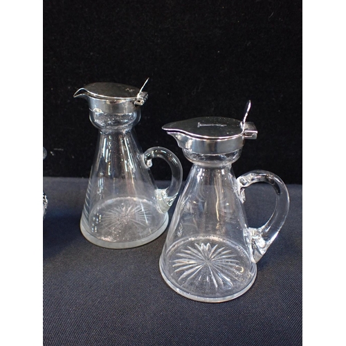 403 - TWO SILVER MOUNTED WHISKY TOTS OR NOGGINS

and a Victorian silver cream jug