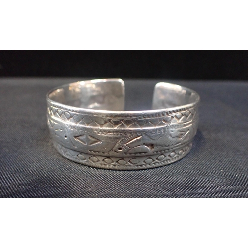 414 - A SILVER BANGLE

Indian or Middle Eastern