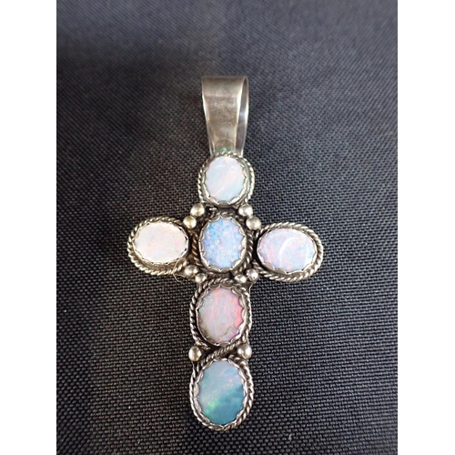 426 - AN OPAL DOUBLET CROSS PENDANT

together with marcasite earrings