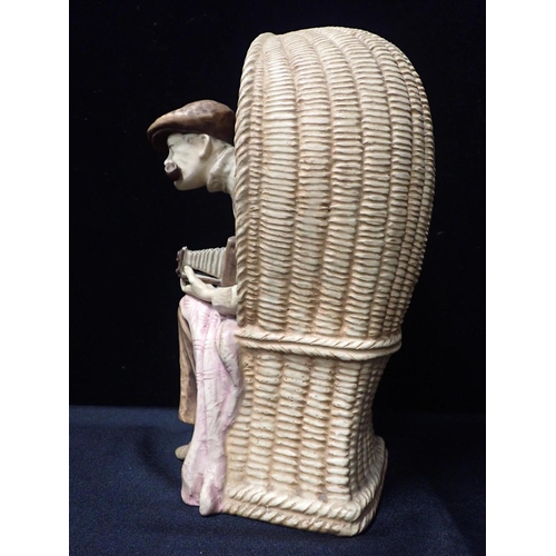 43 - AN AUSTRIAN 'AMPHORA' POTTERY BEACH PHOTOGRAPHER

seated in his basket chair 31cm high, a Lancaster ... 