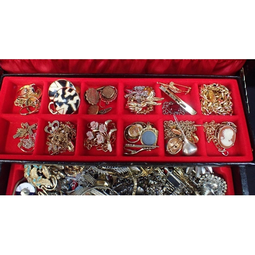 432 - A COLLECTION OF COSTUME JEWELLERY

brooches etc, contained in a three-tier jewellery box