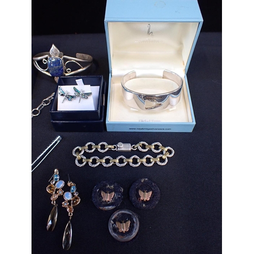 433 - A COLLECTION OF COSTUME JEWELLERY

including a Swarovski ring; a lapis bangle; a a dyed hardstone br... 