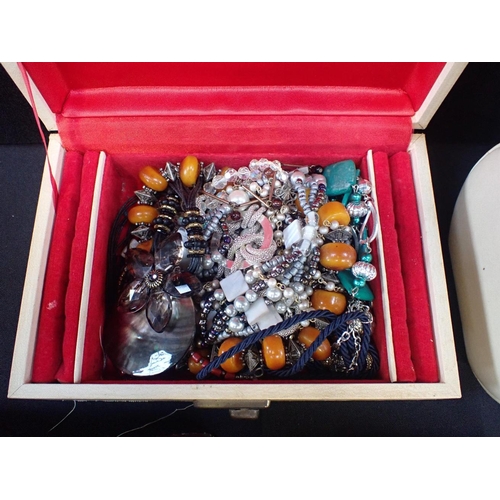 449 - TWO JEWELLERY BOXES

containing a quantity of costume jewellery and other boxes