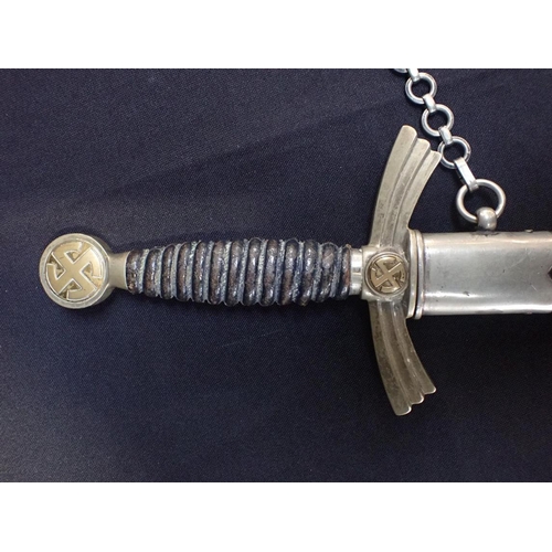 524 - A LUFTWAFFE DRESS DAGGER

with scabbard and chain (surface wear to scabbard, worn plating)

Note: Yo... 