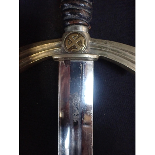 524 - A LUFTWAFFE DRESS DAGGER

with scabbard and chain (surface wear to scabbard, worn plating)

Note: Yo... 