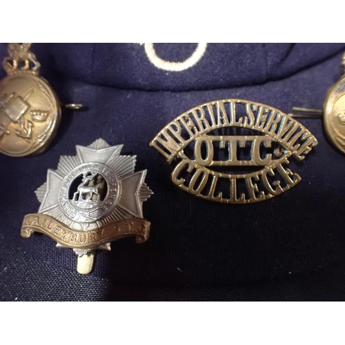 532 - IMPERIAL SERVICE COLLEGE OTC TITLE BADGE

a Haileybury OTC cap badge, two other Imperial Service Col... 