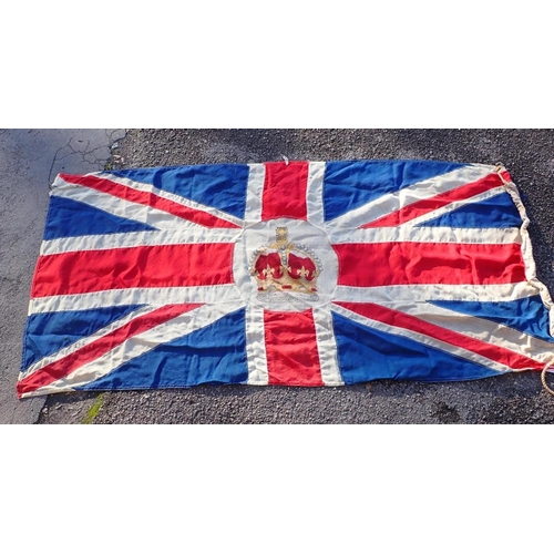 64 - A VINTAGE UNION FLAG, WITH PRINTED CROWN

to the centre, woollen, all sewn pieces , approx 95 x 190c... 