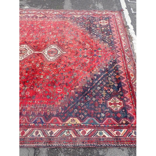 737 - A LARGE QASHQAI SHIRAZ CARPET

red ground 235 x 325cm