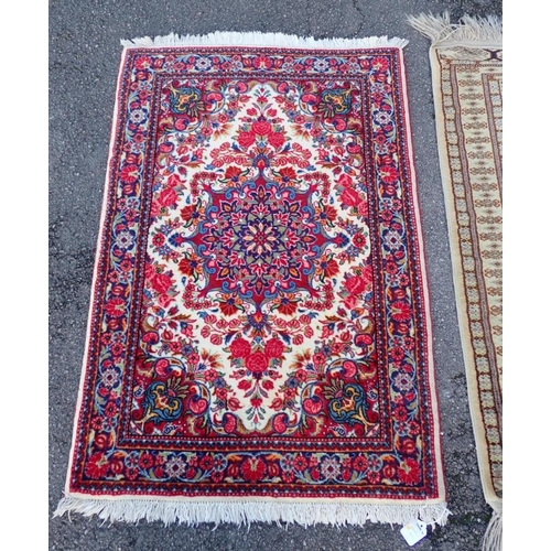 738 - A SMALL HAND KNOTTED PERSIAN RUG

in bright colours 72 x 105cm plus fringes, and another 84 x 107cm ... 