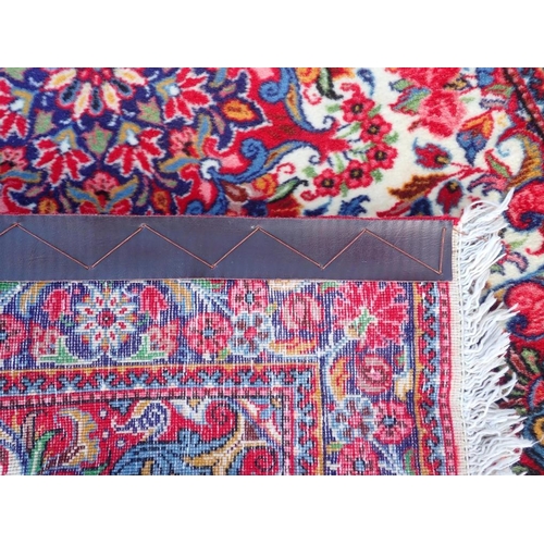 738 - A SMALL HAND KNOTTED PERSIAN RUG

in bright colours 72 x 105cm plus fringes, and another 84 x 107cm ... 