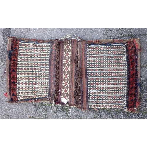 739 - A TURKISH BERGAMA CHUVAL BAG

83 x 108cm and a Baluch saddle bag