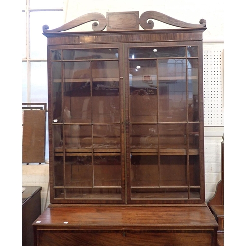 763 - A REGENCY MAHOGANY SECRETAIRE BOOKCASE

the glazed top section with old glass, pierced pediment and ... 