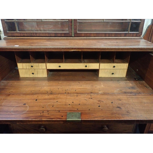 763 - A REGENCY MAHOGANY SECRETAIRE BOOKCASE

the glazed top section with old glass, pierced pediment and ... 