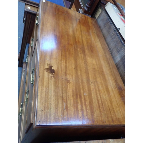 784 - A GEORGE III MAHOGANY CHEST OF DRAWERS

with brass handles and escutcheons, on (replaced) bracket fe... 