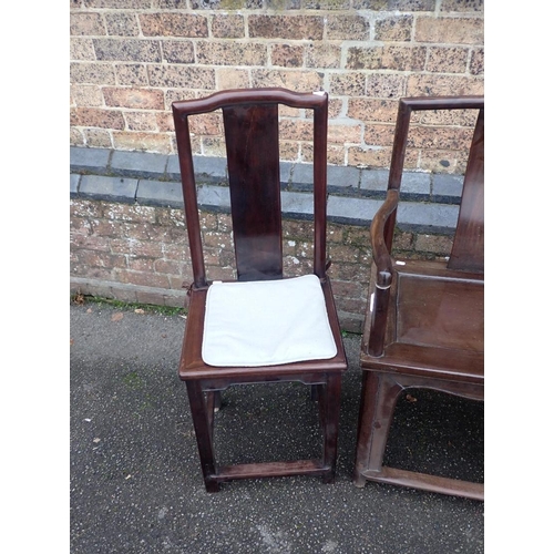 792 - A CHINESE HARDWOOD ARMCHAIR

56cm wide, and two similar side chairs with narrow seats 39cm wide (3)