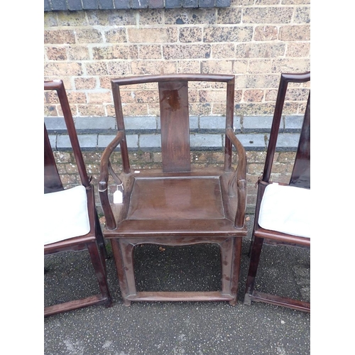 792 - A CHINESE HARDWOOD ARMCHAIR

56cm wide, and two similar side chairs with narrow seats 39cm wide (3)