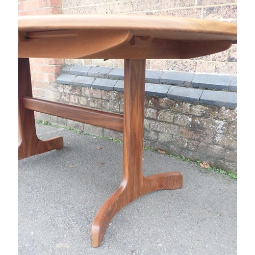 797 - G-PLAN: A TEAK EXTENDING DINING TABLE

with integral hinged leaves, 107 x 163cm, opening to 208cm lo... 