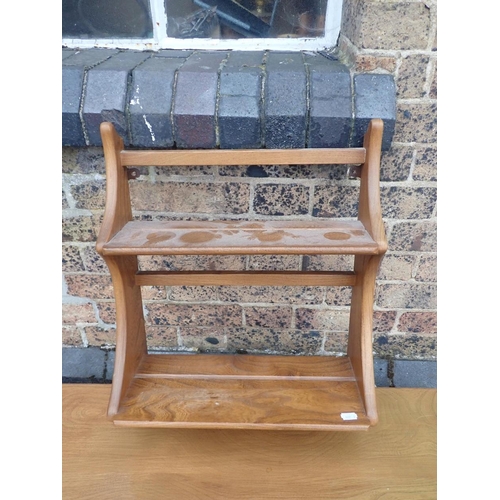 819 - ERCOL: A BLOND ELM DROP-LEAF DINING TABLE

125 x 114cm (open), and a narrow Ercol elm plate rack 43c... 