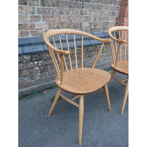 820 - ERCOL; A PAIR OF 'COWHORN' ARMCHAIRS

with blue labels (some wear to finish)