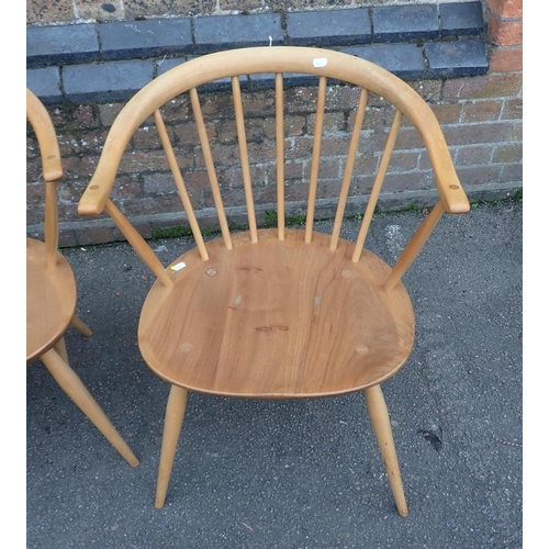 820 - ERCOL; A PAIR OF 'COWHORN' ARMCHAIRS

with blue labels (some wear to finish)