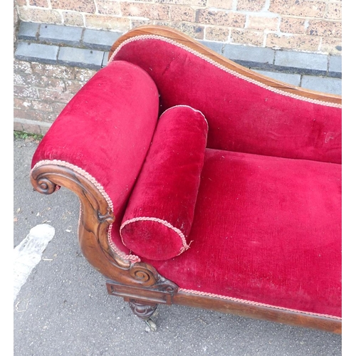 825 - AN EARLY VICTORIAN ROSEWOOD CHAISE LONGUE

with scrolled end and back, on brass castors 180cm long