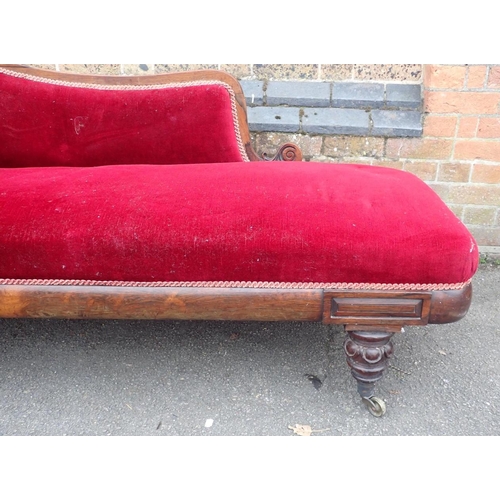 825 - AN EARLY VICTORIAN ROSEWOOD CHAISE LONGUE

with scrolled end and back, on brass castors 180cm long